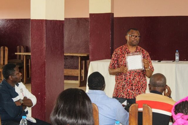 Prof Charles Wondji presenting a spatial repellent during a stakeholder engagement meeting in Ntui, Cameroon